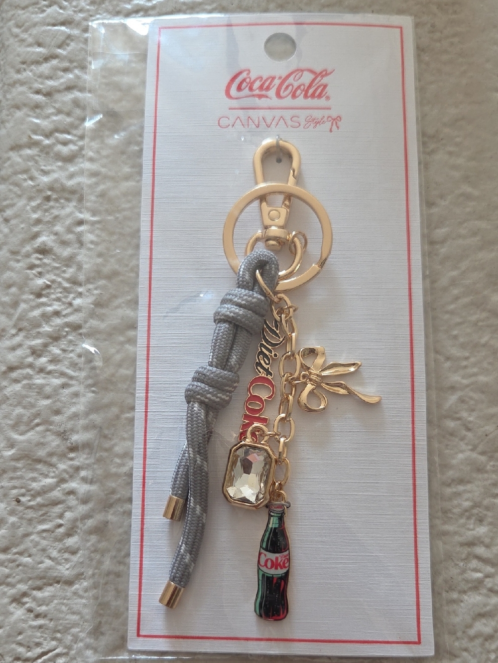 Coca Cola Gold-Tone Keychain with Gray Knot and Bottle Charm